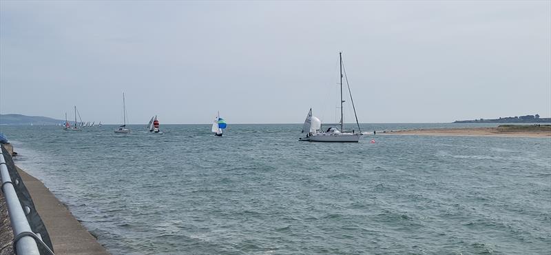 The fleet returning during the 2025 Doyle Sails GP14 Championship of Ireland at Rush Sailing Club photo copyright Lauren O'Hare, Aisling Kelly & Andy Johnston taken at Rush Sailing Club and featuring the GP14 class