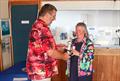 SYC Commodore Scott McColm presents Fiona Blandford with the greatest contribution trophy, keeping the bar stocked and much more - Kippford Week at Solway © Nicola McColm
