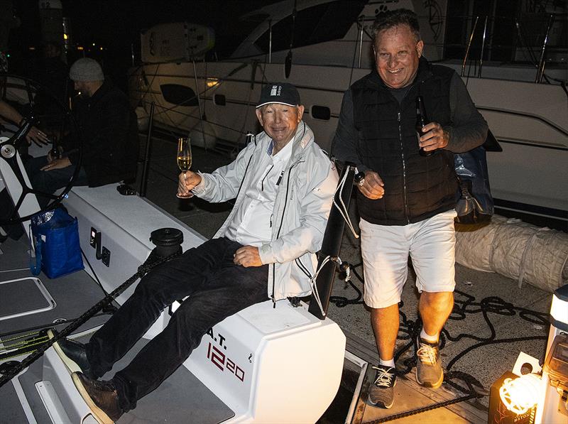 Gerry Hutton demonstrates his custom seating position placed in both quarters, as Jamie MacPhail helps celebrate the arrival of the new M.A.T.1220, Bushranger photo copyright John Curnow taken at Royal Prince Alfred Yacht Club and featuring the IRC class