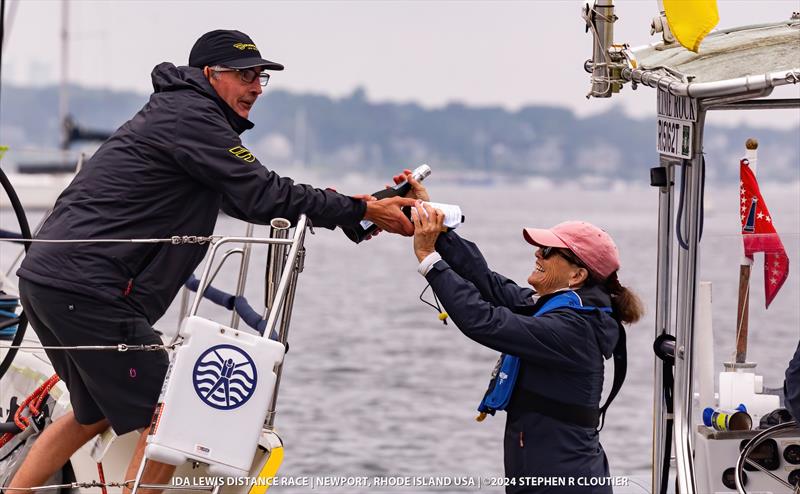 Prosecco hand-off at the finish - Ida Lewis Distance Race 2024 photo copyright Stephen R Cloutier taken at Ida Lewis Yacht Club and featuring the IRC class