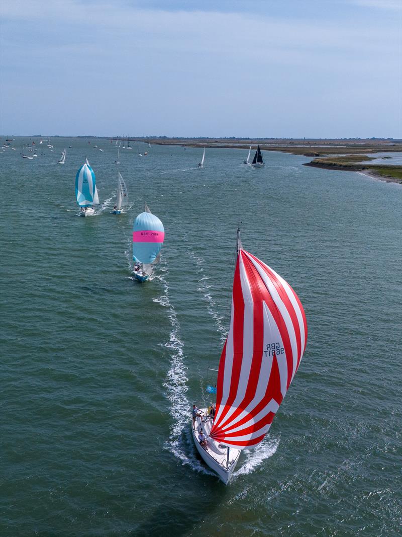 Rondo, helmed by Richard Taylor, leads the class 5 downwind on 7th day of Burnham Week 2024 photo copyright Petru Balau Sports Photography / sports.hub47.com taken at Royal Corinthian Yacht Club, Burnham and featuring the IRC class