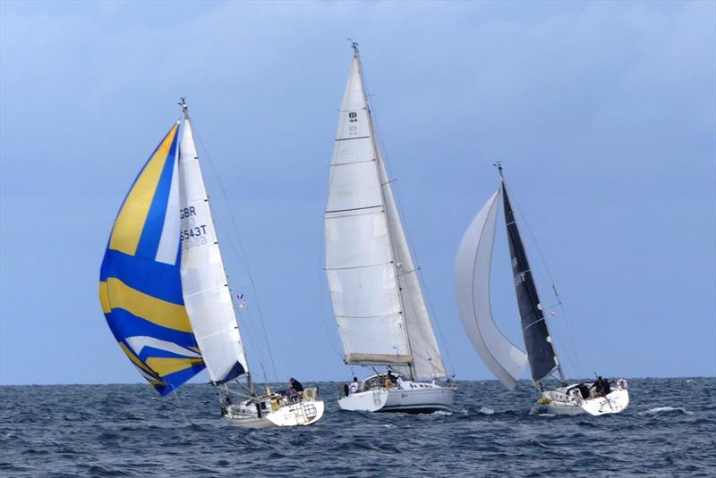 Knight Star, Rico and Jack Rabbit leaving the Videcoq buoy during the Waller-Harris Two-handed Triangle Race photo copyright Bill Harris taken at Royal Channel Islands Yacht Club and featuring the IRC class