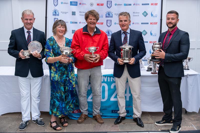 Stephen Herring, Mel Lewis, David Harris and Ralph Herring are helped by the RBYC's Commodore David Smith to present the trophies won during Burnham Week 2024 - photo © Petru Balau Sports Photography / sports.hub47.com