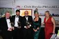 Stephen Tudor, SamandAndrew Hall receiving Jackknife and Pata Negra trophies from Vice Commodore Victoria Cox and Commodore Lyndsay Harrold - Pwllheli SC Christmas Prize-giving &copy; Gerallt Williams