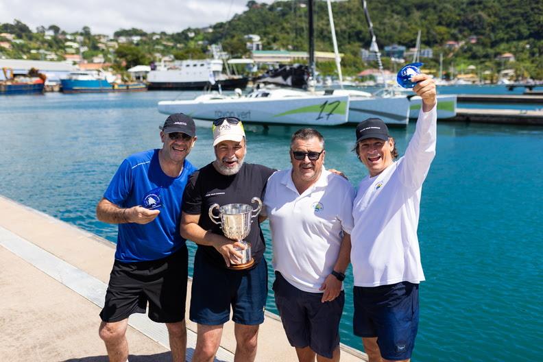 Multihull Line Honours Trophy for Oran Nataf and crew, presented by RORC Racing Manager Steve Cole - 2025 RORC Transatlantic Race photo copyright Arthur Daniel / RORC taken at Royal Ocean Racing Club and featuring the IRC class