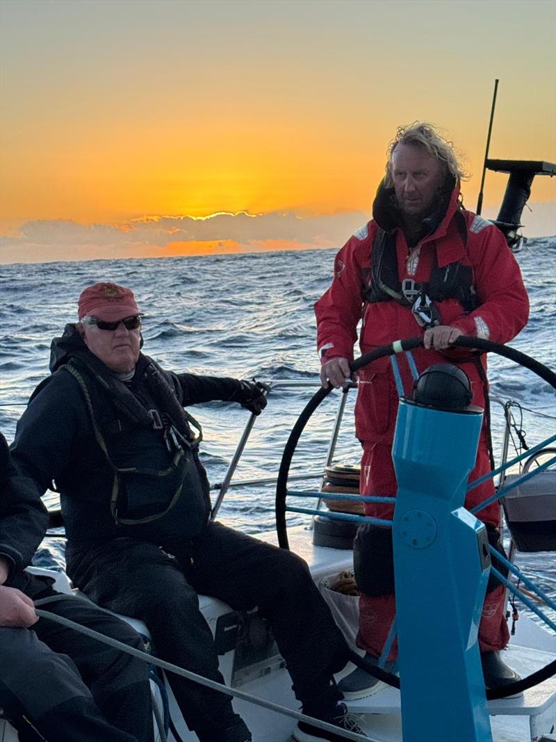 Peter 'Fletch' Fletcher on Antipodes helm with magic sunrise - 2025 Sydney to Auckland Ocean Race - photo © Antipodes