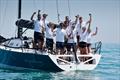 Impetuous team celebrate, GBR 7737, on Monday at the International Paint Poole Regatta 2026 &copy; Paul Wyeth / www.pwpictures.com