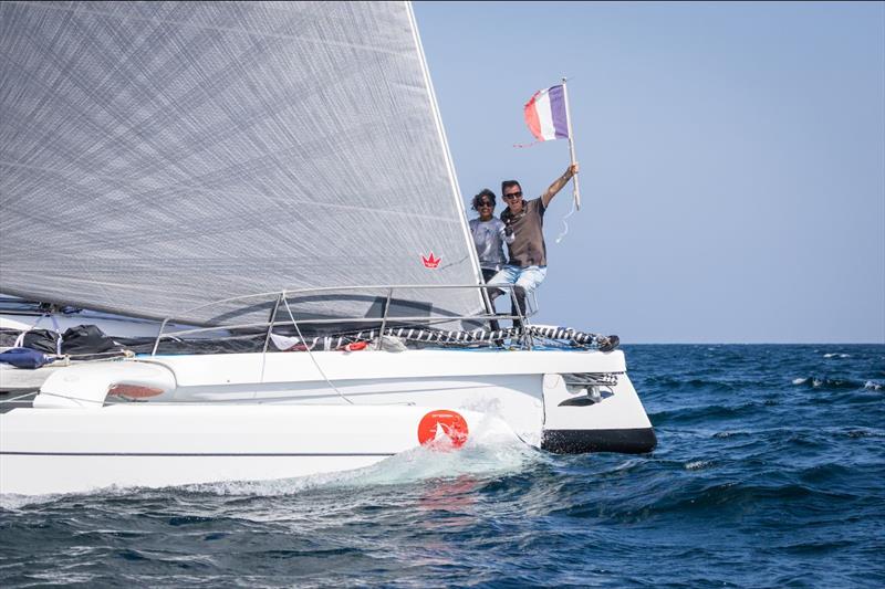 Xavier and Tania Bouin waving the French flag - photo © Mikey Brignall / DOSC