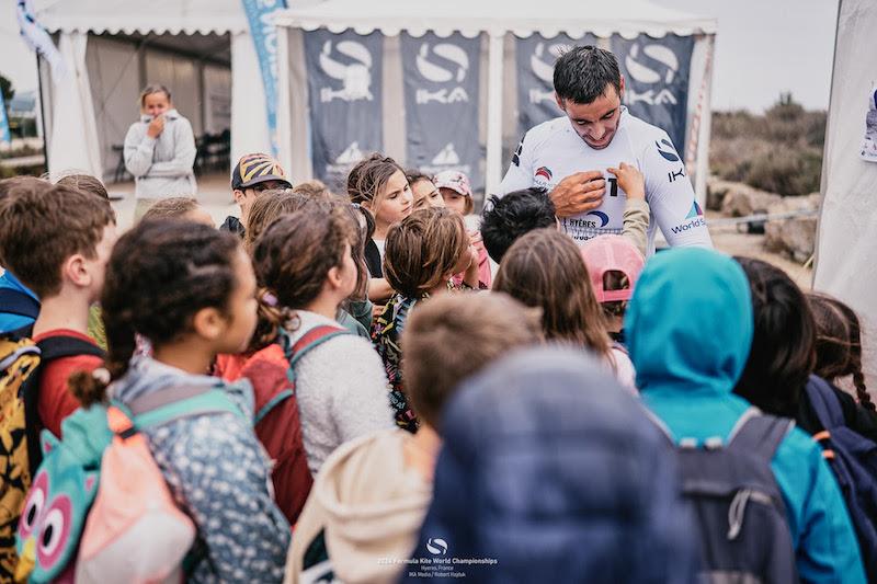 2024 Formula Kite World Championships in Hyères: Axel Mazella entertaining some local school kids visiting the venue - photo © IKA Media / Robert Hajduk