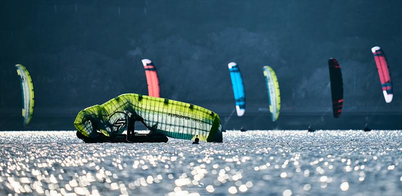 Tricky moments in the patchy breeze near the windward mark - 2024 KiteFoil World Series Austria photo copyright IKA media/ Robert Hajduk taken at  and featuring the Kiteboarding class