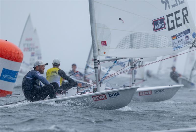 Bow to bow duel between the leading Italian Lorenzo Brando Chiavarini and Philipp Buhl after the ILCA 7 rounded the buoys at Kieler Woche - photo © Felix Diemer / Kieler Woche