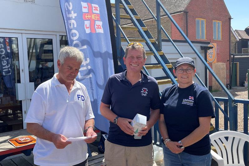 Whitstable YC RNLI Pursuit Race third-placed Niall Martin, with Commodore David Figgis and RNLI's Kellie Gray - photo © Steve Gray