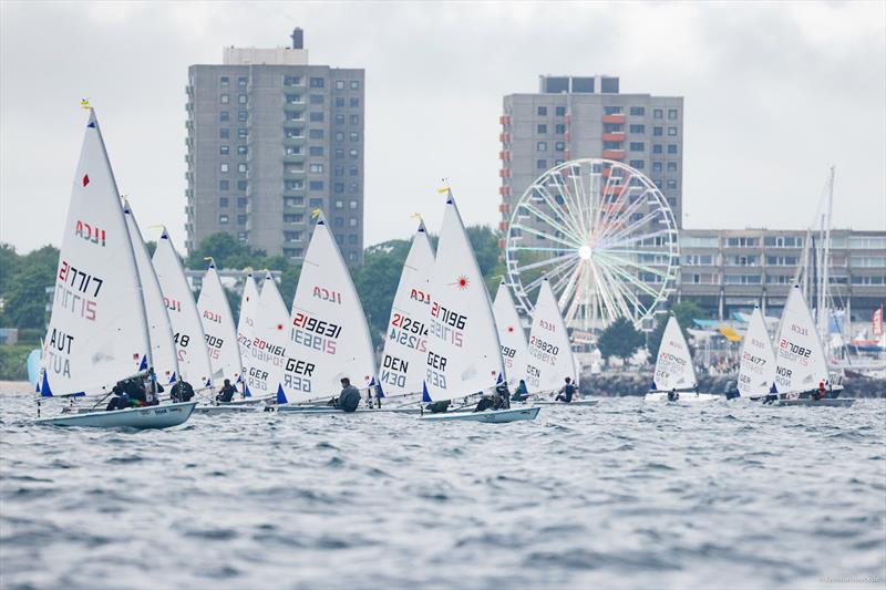 One of two open ILCA 6 fleets racing the media course covered by KielerWoche.TV in front of Kiel-Schilksee Olympic Center at Kiel Week photo copyright ChristianBeeck.de / Kieler Woche taken at Kieler Yacht Club and featuring the ILCA 6 class