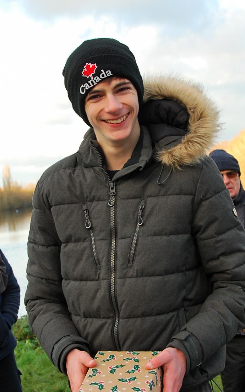 Brass Monkey Christmas race at Abbey Meads - Oliver also delighted to receive his third place prize photo copyright Roger Stollery taken at Guildford Model Yacht Club and featuring the Marblehead class