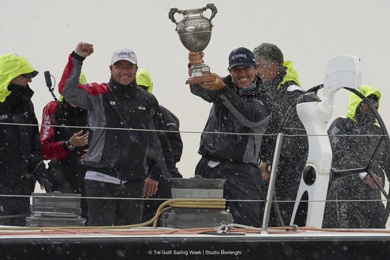 ARCA SGR's Furio Benussi with his line honours trophy and left his talented Trieste tactician Lorenzo Bressani photo copyright Tre Golfi Sailing Week / Studio Borlenghi taken at Circolo del Remo e della Vela Italia and featuring the Maxi class