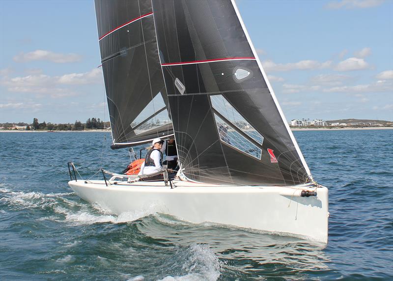 The team were enthusiastic to receive on water trimming tips from Paul Eldrid - photo © OneSails Perth