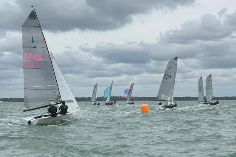 Windward mark rounding in choppy wind cross tide - Merlin Rocket Silver Tiller at Lymington Town photo copyright LTSC taken at Lymington Town Sailing Club and featuring the Merlin Rocket class