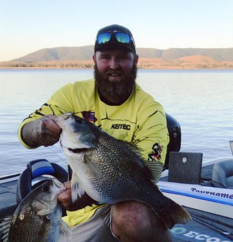 Aussie angler Daniel McCoy caught and released 4.45-kg Australian bass (Macquaria novemaculeata) on August 18, 2018 while fishing Lake Somerset in QLD, Australia. McCoy played fish for 15 minutes on 6-pound test line after it hit lure he was casting. - photo © IGFA