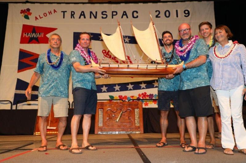 The crew of overall winners on Hamachi posing with the new King Kalakaua Trophy with trophy artist Ka'ili Chun (right) - Transpac 50 - photo © Sharon Green / Ultimate Sailing