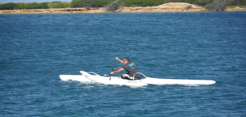 Seal Biologist David Schofield paddling his OC1 canoe off the Hawaiian shore. - photo © New Hope Canoe Club