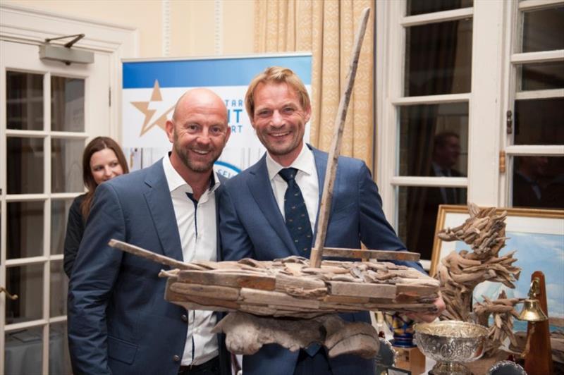 Richard Klabbers, Sevenstar's Managing Director (right) presents awards to Ian Walker whose record monohull run on VO 65 Azzam Abu Dhabi Ocean Racing of 4 days 13 hrs 10 mins 28 secs is the benchmark to beat in the 2022 race photo copyright RORC taken at Royal Ocean Racing Club