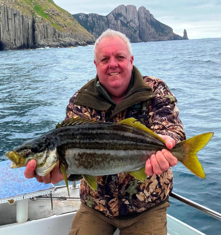 Peter Simons with a last season trumpeter. - photo © Carl Hyland