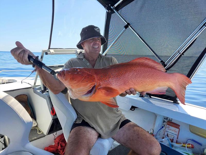 Brett Healey with a solid coral trout that measured 91cm - photo © Fisho's Tackle World