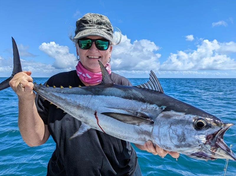 Heidi getting in on the line burning action with a nice longtail tuna - photo © Fisho's Tackle World