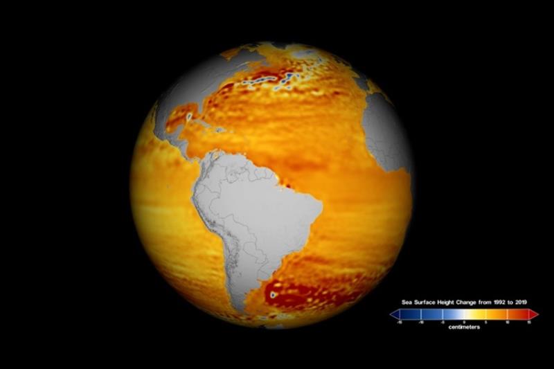 Graphic of globe showing sea surface height change from 1992 to 2019. - photo © NASA