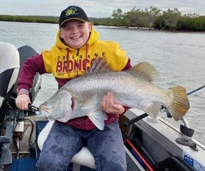Young gun angler Charlie with a nice saltwater barra. - photo © Fisho's Tackle World