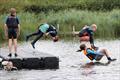 Frollicking off the pontoon during Blackwater Sailing Club Cadet Week © Anna Lau and James Torrance