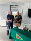 Event organiser Richard Lambert presents the BBSC Start Racing Course Regatta trophy to 2024 champion Ian Gubb © BBSC