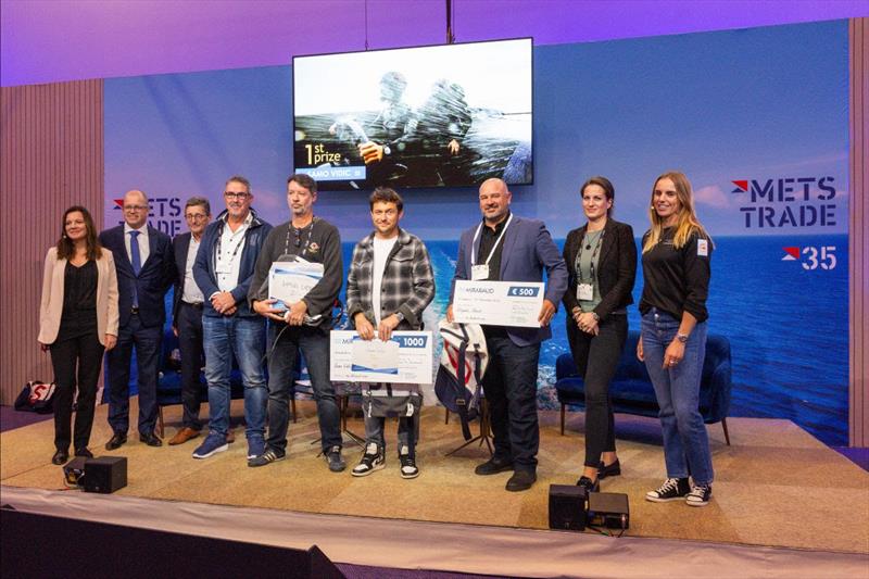 The prize giving 2023 with the winners Samo Vidic, Sam Cade and Craig Greenhill celebrated by METSTRADE Director Niels Klarenbeek (2nd from the left) and olympic champion Marit Bouwmeester (right) photo copyright Yacht Racing Image Award taken at 