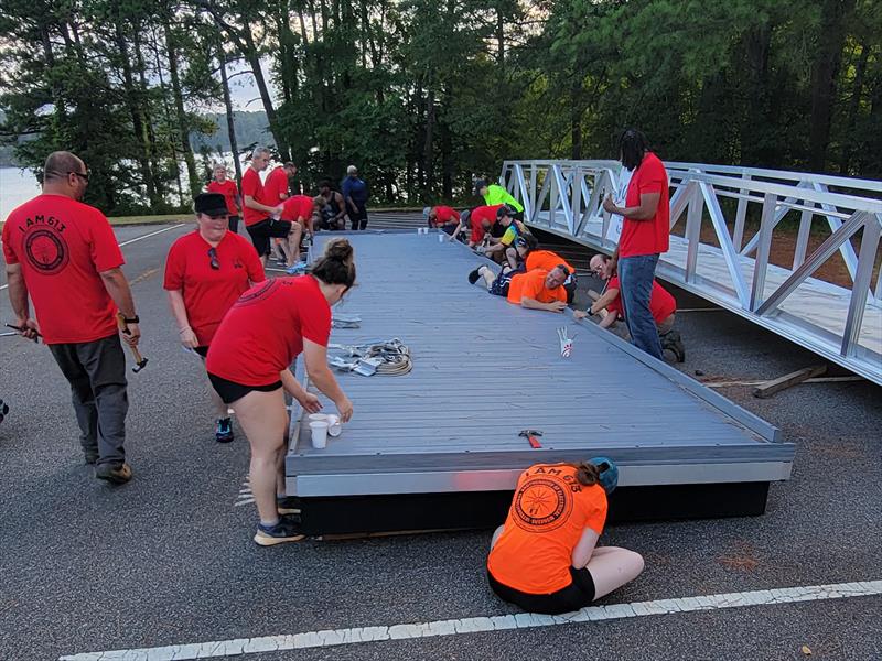 SMART Local 85 and IBEW Local 613 union volunteers preparing the floating dock for installation next to Blockhouse Boat Ramp on Lake Allatoona - photo © Union Sportsmen's Alliance