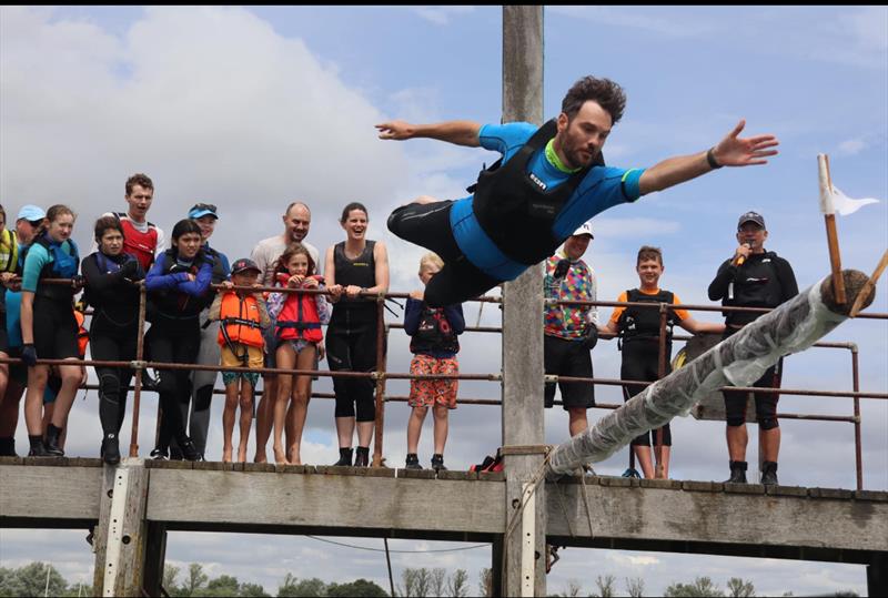 Hugo Berney going for the slippery pole flag at the Blackwater Sailing Club 125th Anniversary Regatta - photo © Zoe Nelson