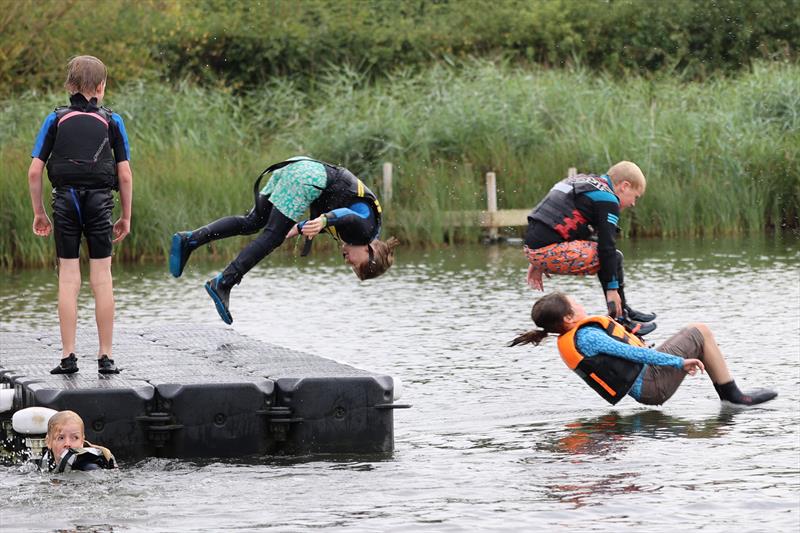 Frollicking off the pontoon during Blackwater Sailing Club Cadet Week photo copyright Anna Lau and James Torrance taken at Blackwater Sailing Club