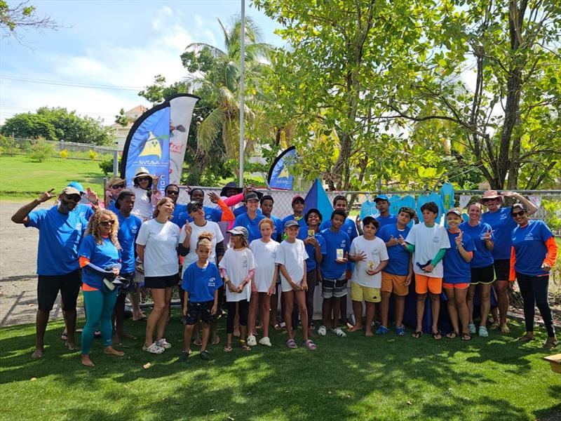 Sailors and helpers with their CG United shirts at the CG United Insurance SVG Youth National Sailing Championships 2024 photo copyright Jenny Trumble taken at 