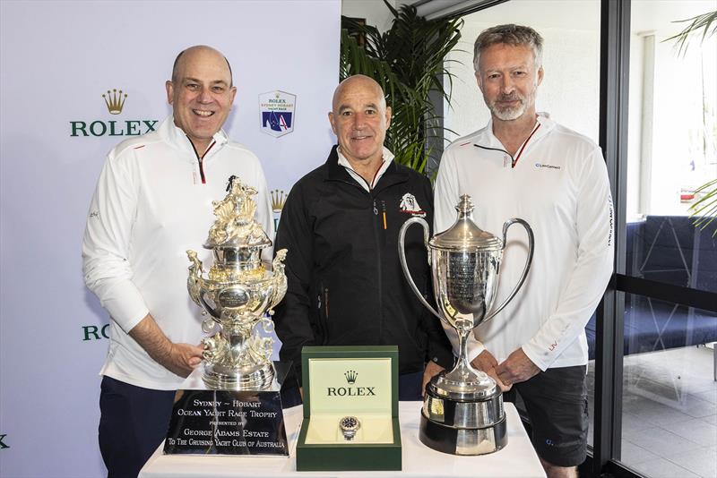 Master Lock Comanche co-skippers Matt Allen and James Mayo and LawConnect owner and skipper Christian Beck standing in front of the trophy for the overall winner, Rolex timepiece and Line Honours trophy  - photo © CYCA | Andrea Francolini