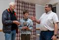 Solway YC Club Champions; joint winners Keith Veasey (left) and Club and Cadet Winner Toby Iglehart, congratulated by Scott McColm, Club Commodore © Nicola McColm