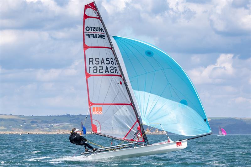 Brennan Robinson on day 2 of the ACO 13th Musto Skiff 2024 Worlds at the WPNSA photo copyright Michael Oliver taken at Weymouth & Portland Sailing Academy and featuring the Musto Skiff class