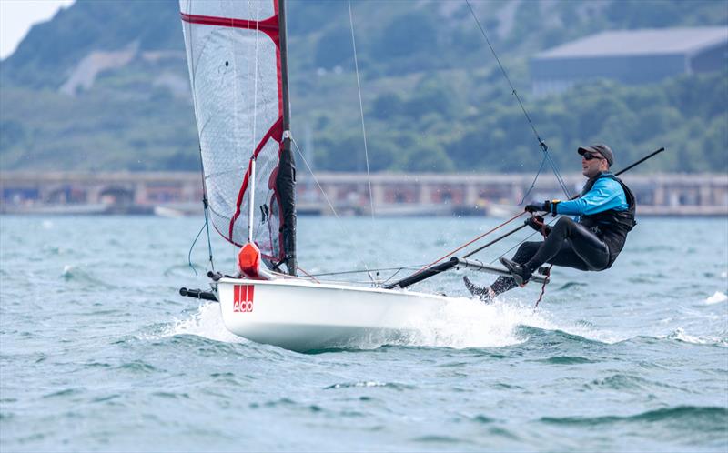 Sam Pascoe on day 2 of the ACO 13th Musto Skiff 2024 Worlds at the WPNSA photo copyright Michael Oliver taken at Weymouth & Portland Sailing Academy and featuring the Musto Skiff class