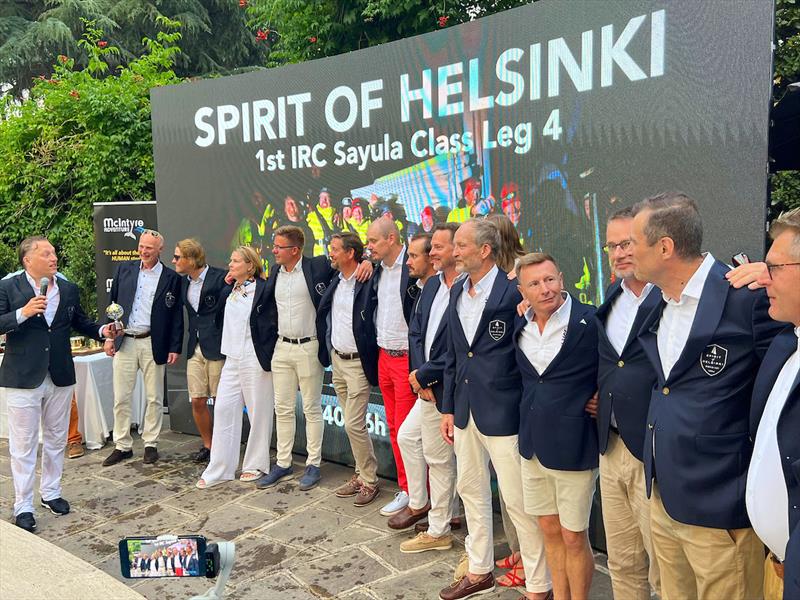 Jussi Paavoseppä (Far Left, Team Spirit of Helsinki) climbed out of the pool, soaking wet, to collect his team's Leg 4 1st Place IRC in Sayula Class and 2nd Place IRC Overall OGR23 trophies photo copyright Marco Ausderau / OGR2023 taken at  and featuring the Ocean Globe Race class