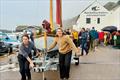 BBA graduate boat builder Katherine Briggs (right) leads her boat 'Campion' to Lyme Regis harbour &copy; Debbie Granville