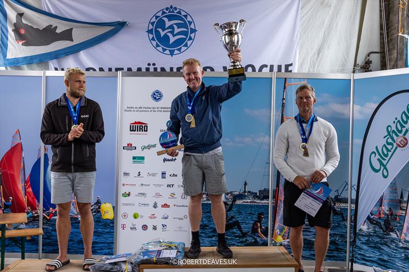 Podium - OK Dinghy Europeans at Warnemünde photo copyright Robert Deaves / www.robertdeaves.uk taken at Warnemünder Segel-Club and featuring the OK class