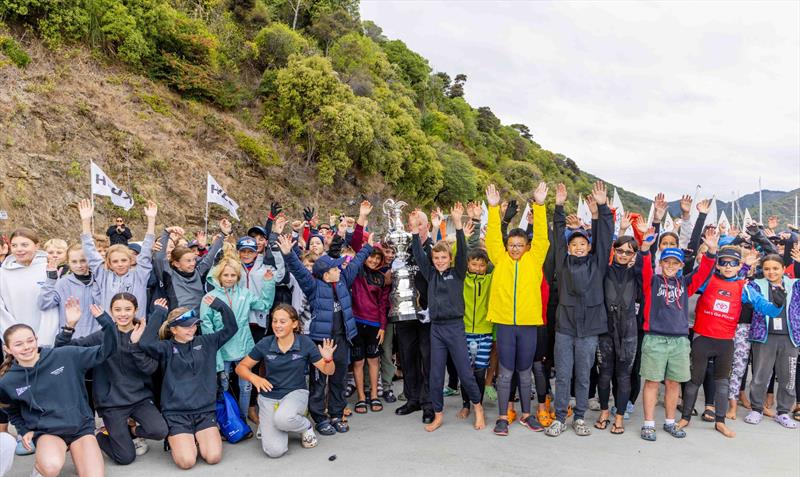 Competitors with the America's Cup at the Toyota New Zealand Optimist National Championships. Queen Charlotte Yacht Club. April 2024 photo copyright Suellen Hurling taken at Queen Charlotte Yacht Club and featuring the Optimist class