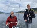 Paul and Leo Bieker on Dark Star, with Ketchikan, Alaska, astern © David Schmidt