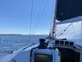 Mount Rainier makes its presence known as Dark Star nears Point Robinson Lighthouse on the 2024 Vashon Island Race © David Schmidt