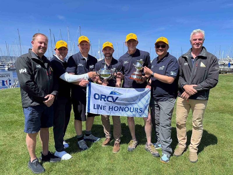 The Jackal with ORCV Race Director Ravid Schuller (L) and ORCV Commodore Cyrus Allen (R) - 2025 Melbourne to Hobart Yacht Race photo copyright Jane Austin taken at Ocean Racing Club of Victoria and featuring the ORC class
