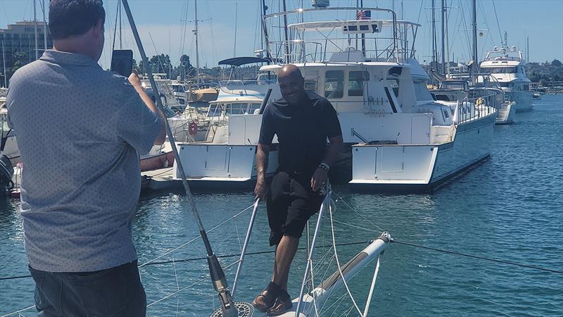 Lawson on the bow of Defiant, his ORMA 60 trimaran - photo © Captain Donald Lawson