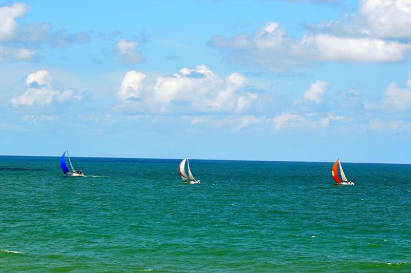 Gulfstreamer competitors pass the Daytona Beach Main Street Pier en route to the finishing line off of Charleston, South Carolina - photo © Image courtesy of the GulfStreamer Offshore Sailboat Challenge